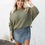 Thumbnail: green sweater front view