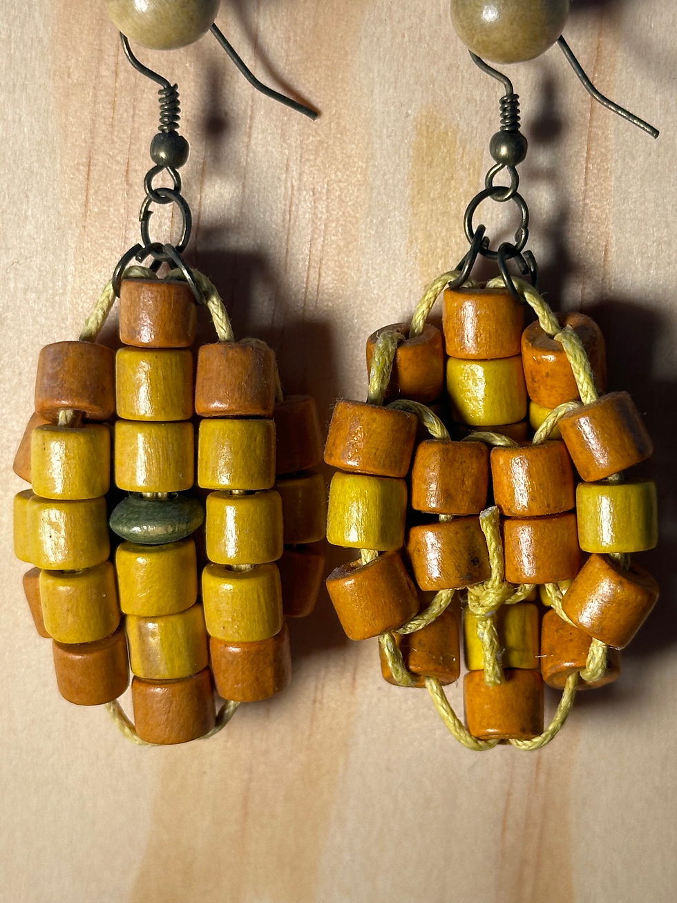 Yellow wooden turtle-shell-shaped earrings design