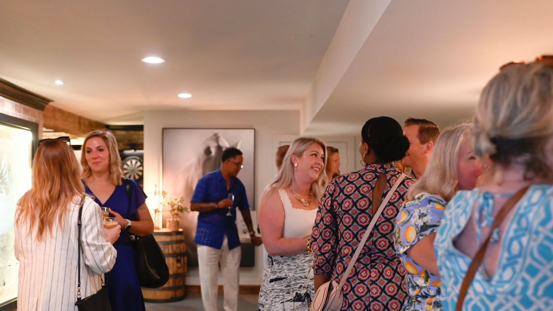 A crowd of guests enjoy the scene in the lower-level speakeasy's Jeptha Creed takeover