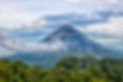 Arenal Volcano with Clouds and Jungle .j
