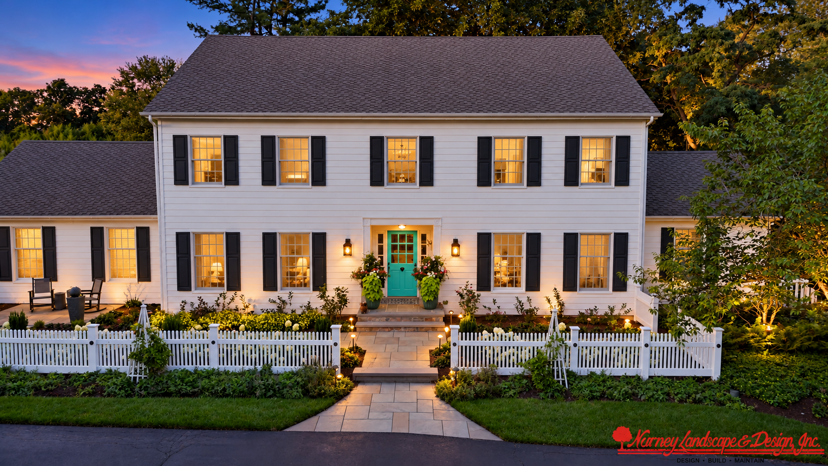 AI-assisted evening interpretation of the white colonial residence with teal door and picket fence, with original Nurney Landscape branding
