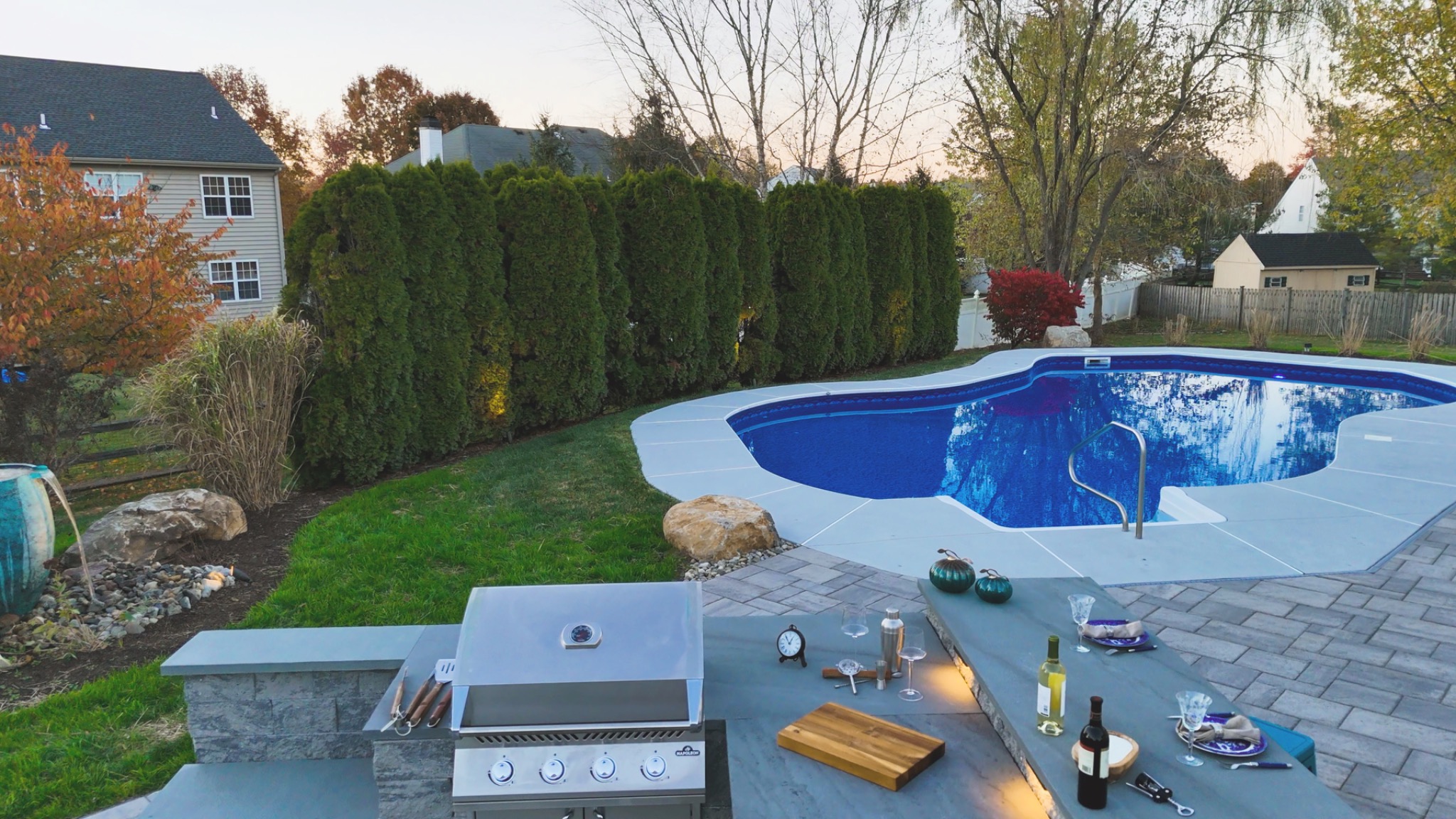 Original ArdeaDrones photograph of a Doylestown outdoor kitchen, pool and hardscape