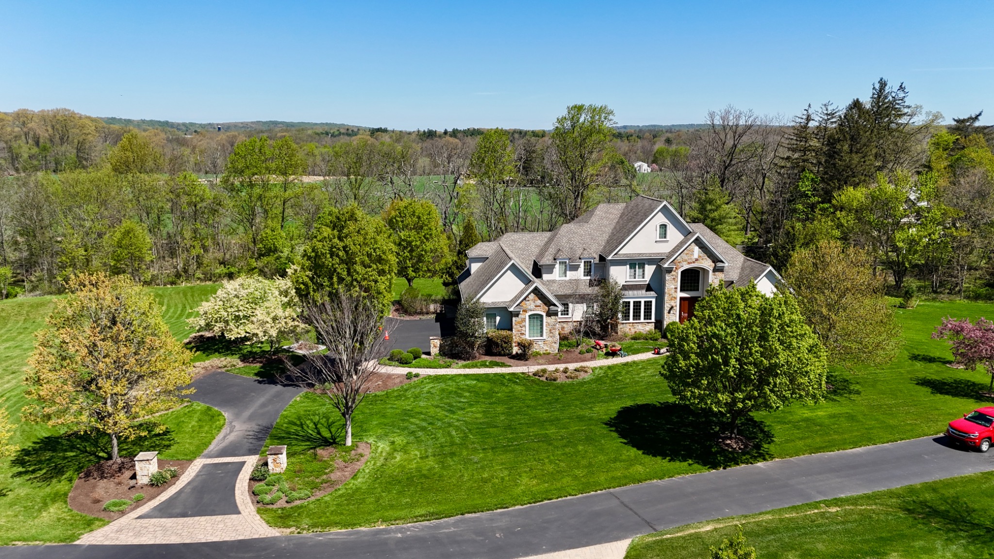 Original ArdeaDrones daytime aerial of an estate surrounded by landscaped grounds