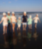 Kids walking in coastal t-shirts in various colors