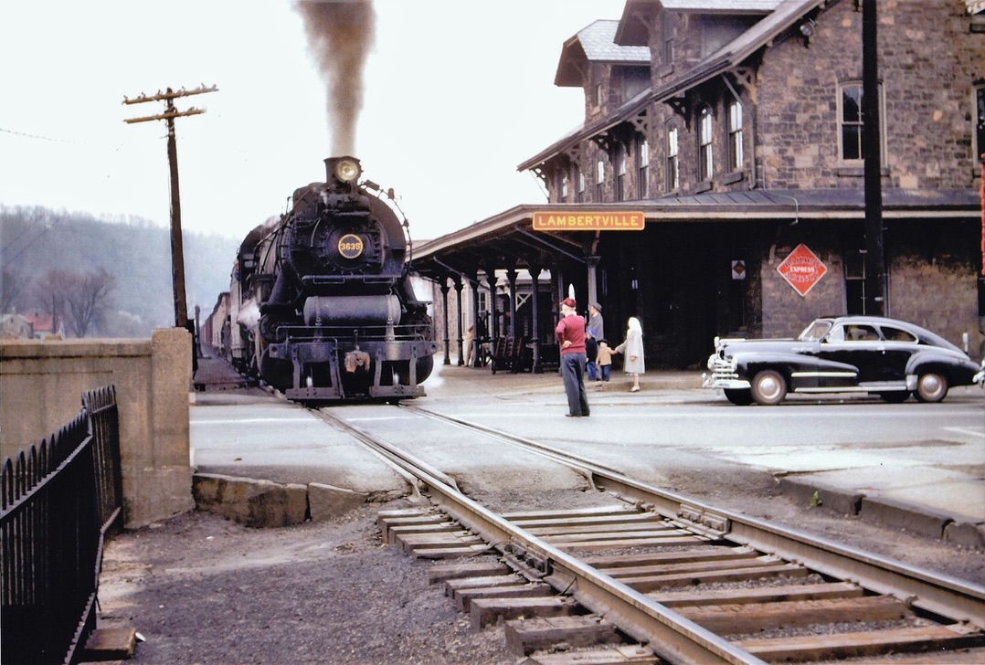 Archival photograph of the Lambertville railroad station and steam train