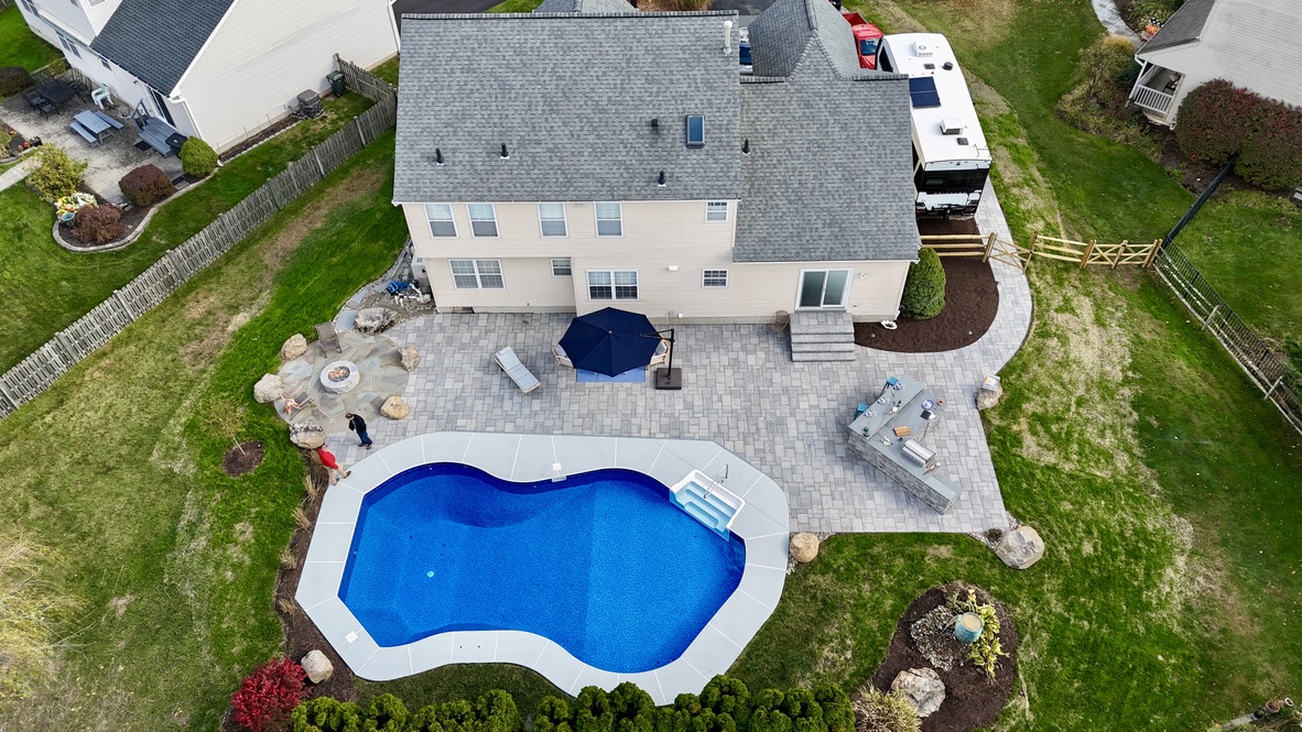 Original aerial photograph of a completed pool and residential landscape