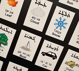 Magnets with an image and description in both English and Assyrian