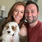 happy couple holding their new white Berrybrook Doodles Puppy