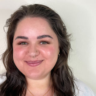 MesmerEyes lashes using brown, burgundy, and deep green color that accentuate her olive green eyes and make her skin glow