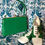 Thumbnail: Original 1960s Pea Green Vinyl Kelly Handbag Shown with green and white shoes Front view