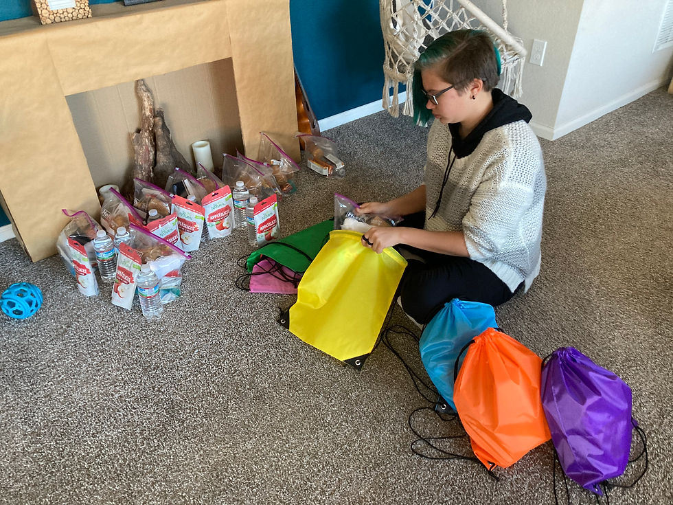 a picture of us putting together care packages for the homeless during the holiday
