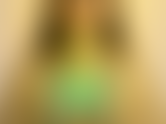 Woman with emerald beam of light from heart to brow