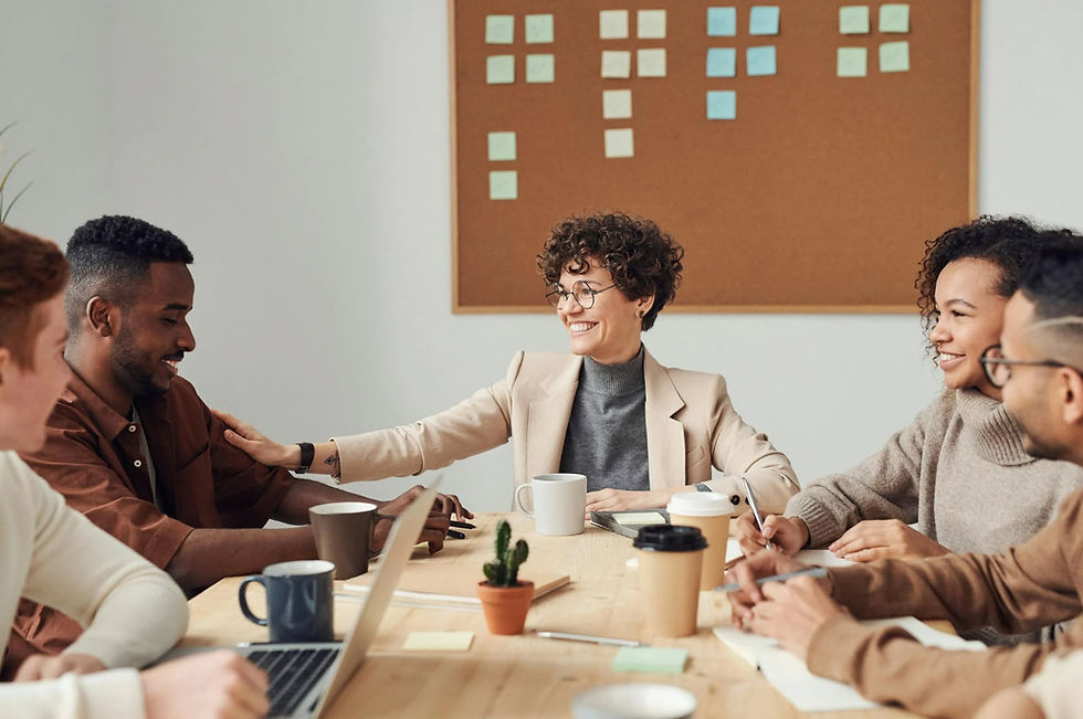 A group of people working together, one blind person being part of the team.