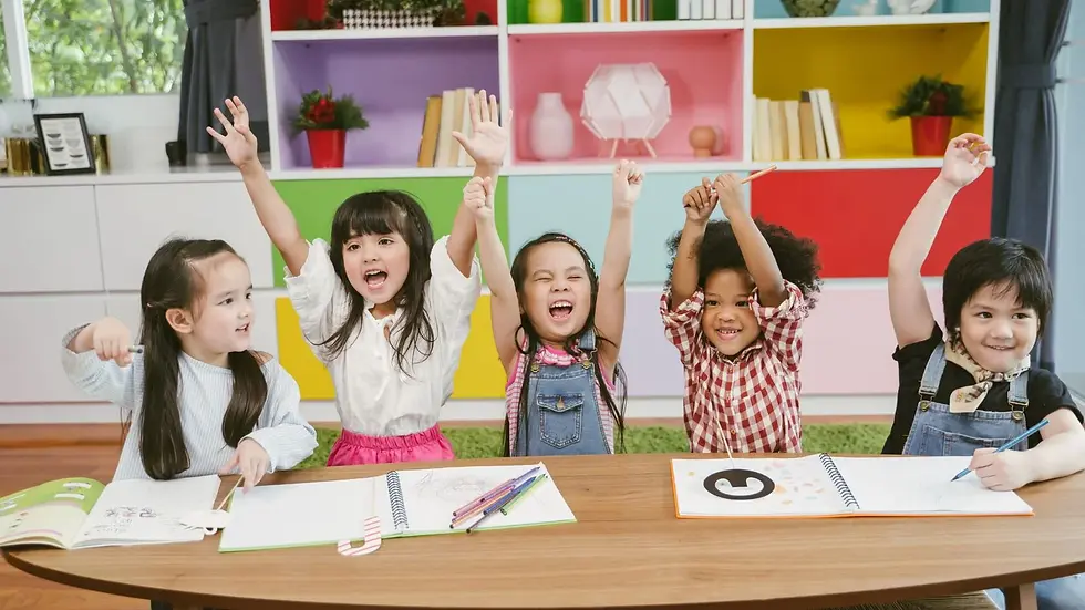 Children raising up their hand in a kindergarten class
