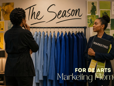 Two women look at a rack of blue clothes surrounded by yellow and green inspo boards. The marketing woman looks resolved.