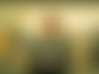 A woman composed in front of a podium while in the background the marketing room is in chaos