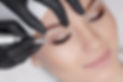 Cosmetologist making permanent makeup, close up. Tattooist making permanent make-up. Attra