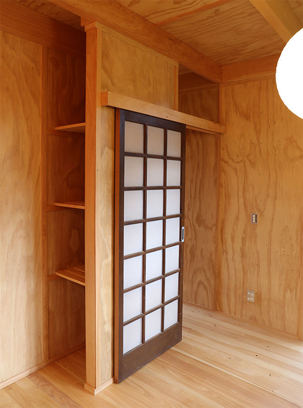 Samurai House interior photo looking custom door and shelving