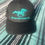 Thumbnail: Black Speckle W/ Turquoise Logo Baseball Hat