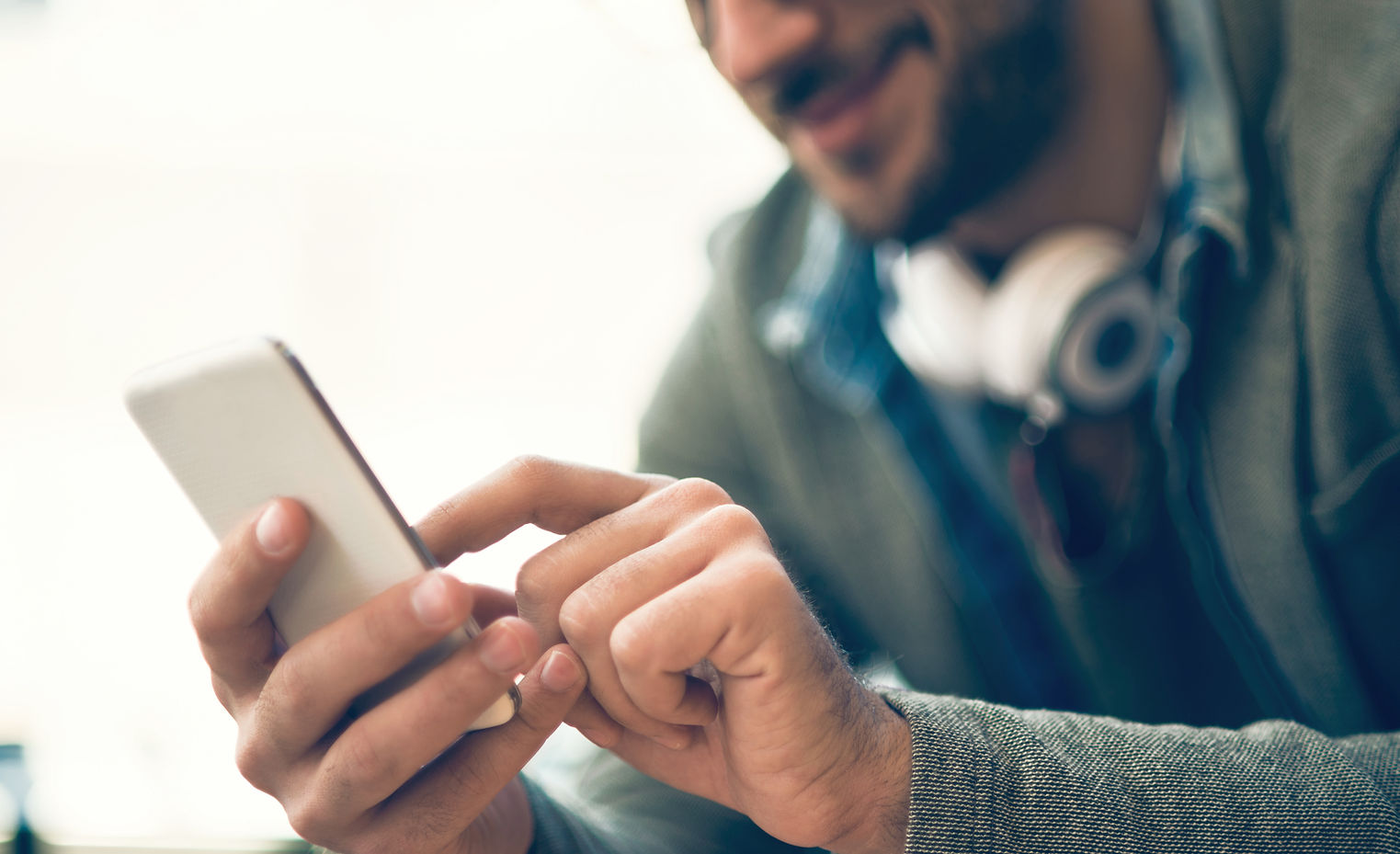 Man typing on a phone
