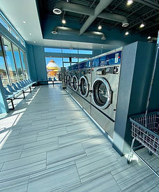 Row of modern washers at rk washateria