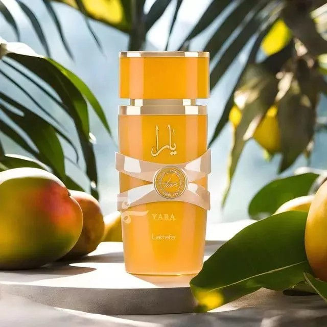 Miniatura: Decante de perfume dourado com laço, mangas e folhas