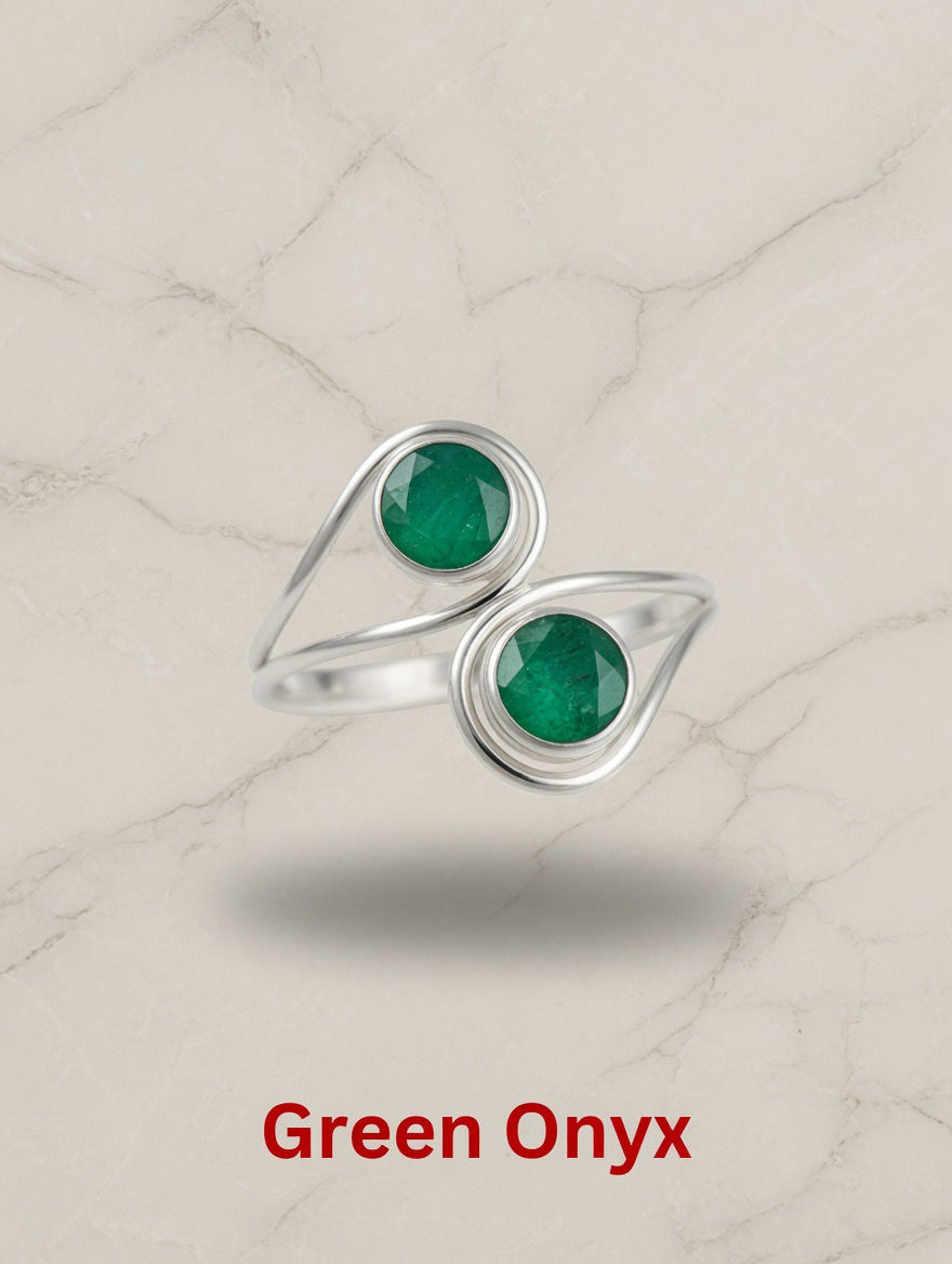 Smooth vibrant green oval Onyx gemstone set in a polished sterling silver rings.