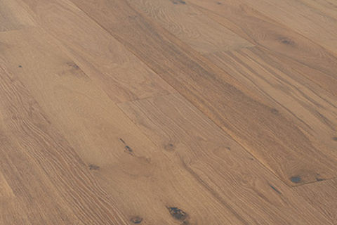 Wide-plank hardwood flooring in a natural finish with visible wood grain and knots