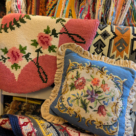 Collection of vintage cushions, rugs and home furnishings.