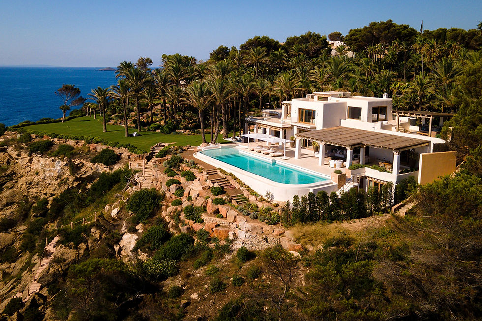 Arial view of one of our luxury Ibiza complexes, showing the villa and pool area surrounded by beautiful trees.