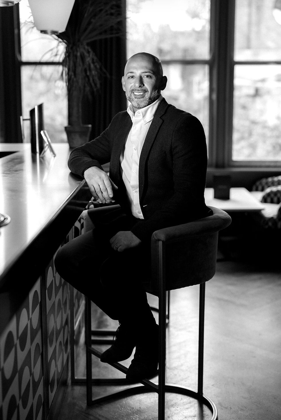 Chris, Safinity coach, sat on bar stool