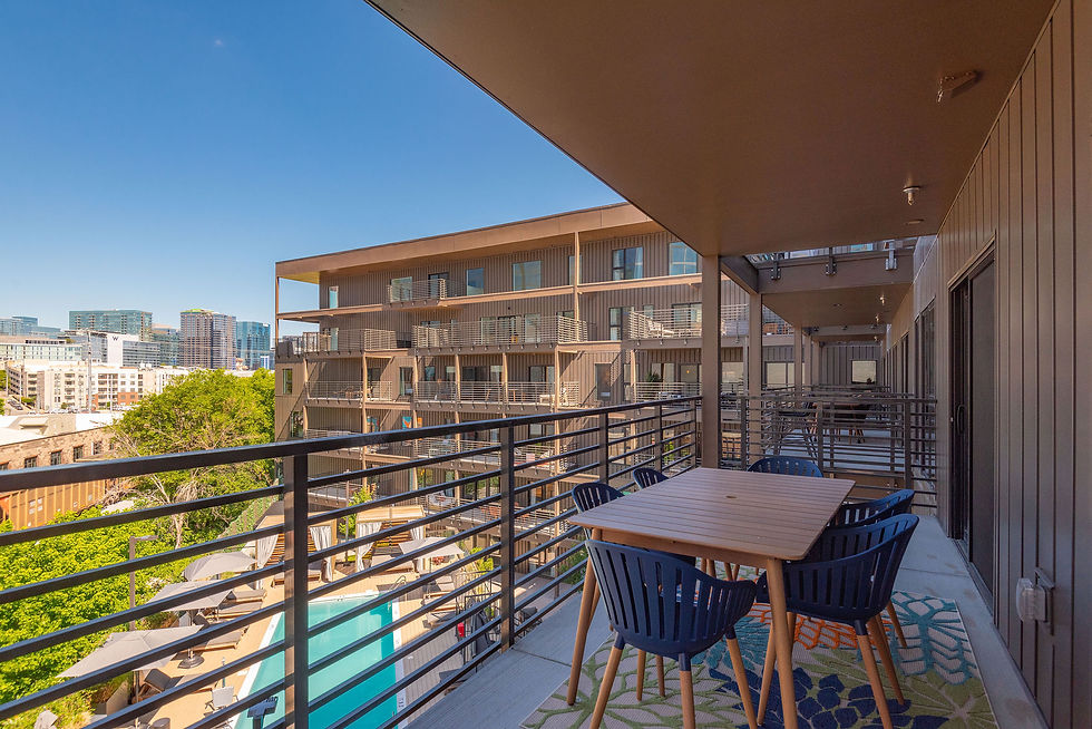 Balcony overlooking a pool in the Hybe building