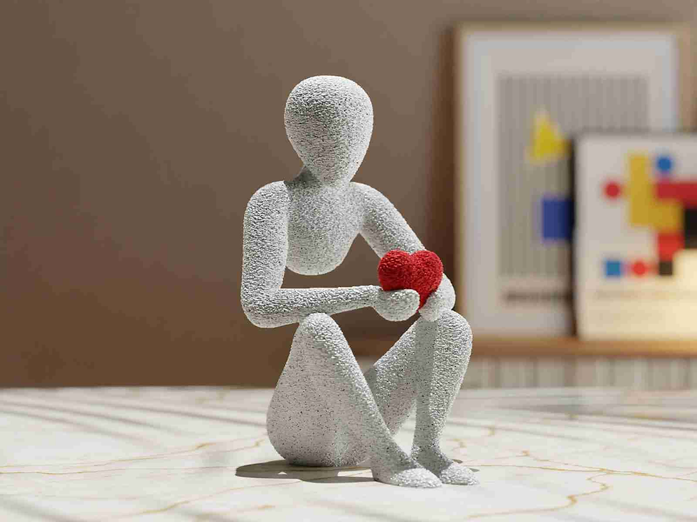 Statue of a person holding a red heart