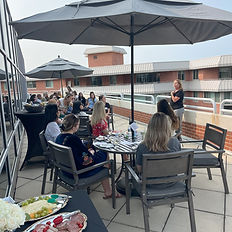 Gourmet appetizer platter and guests seated for wine tasting event led by Spirited Tours.