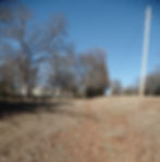 Outdoors next to a cemetery