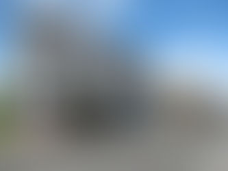 White two story building along a street