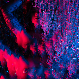 BoudoirXAllie photographing a neon boudoir session in North Texas