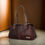Thumbnail: Elegant Brown Leather Handbag with Multiple Zipper