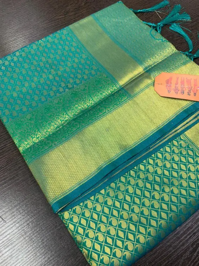 Thumbnail: Elegant Green Silk Saree with Luxurious Gold Border