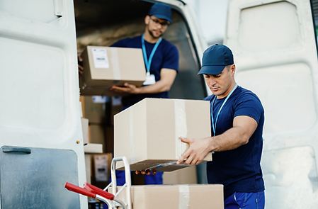 young-courier-his-colleague-unloading-cardboard-boxes-from-delivery-van 1.png
