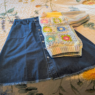 Blooming Daisy Sweater with a dark blue jean skirt