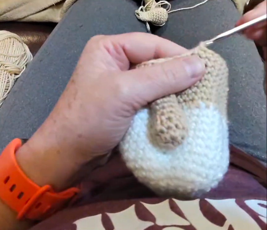 Eye-level view of crochet squares joined seamlessly in a colorful blanket