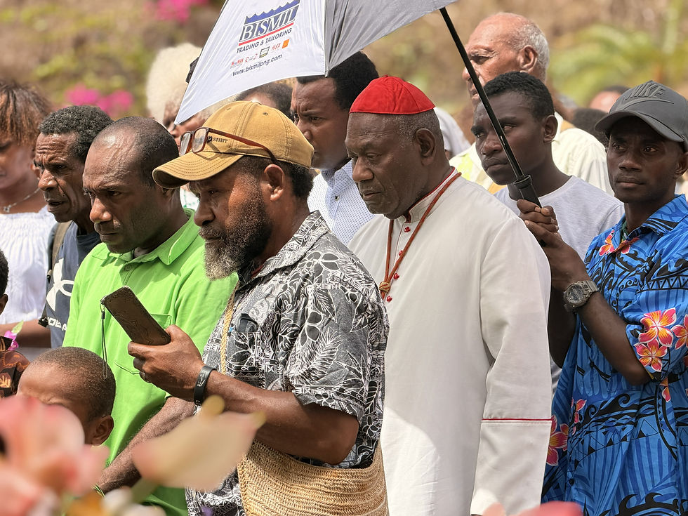 Ashes to ashes, hope to hope. His Eminence John Cardinal Ribat MSC, praying where the earth has kept Fr. Francis's mortal remains in Bomana
