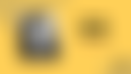 Smiling woman with dreadlocks in grayscale. Text: Aure Nash 2025 Vanguard. Yellow background with black and orange text, abstract pattern.