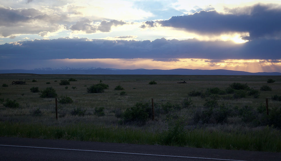 Sunset on snowy mountains in Wyoming by Ethan Bertini | That's Wild Outdoors