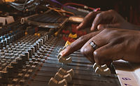 Hands using recording control panel
