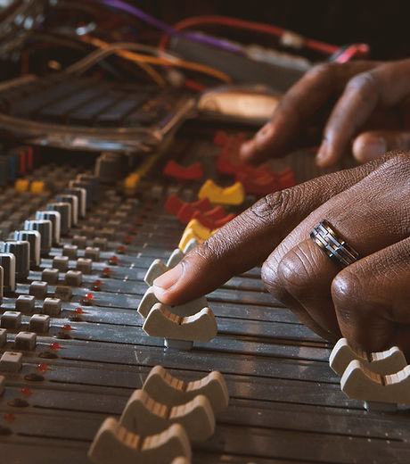 Hands using recording control panel