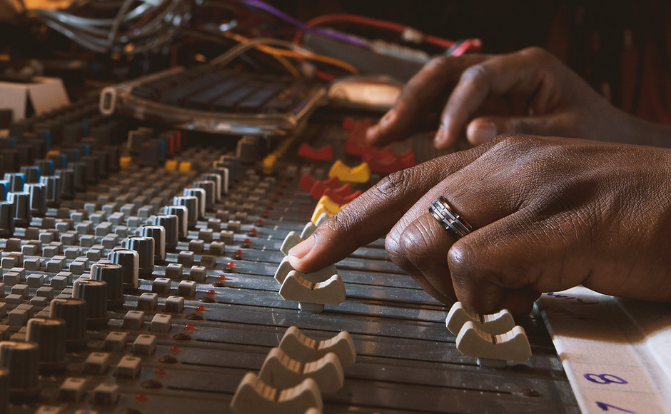 Hands using recording control panel