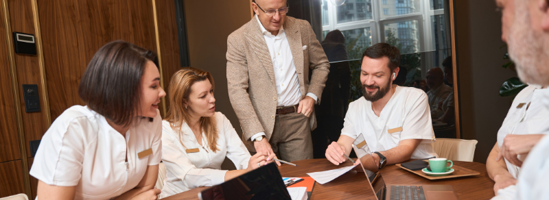 Professional team in an office discussing business funding.