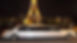 Une limousine circule de nuit devant la Tour Eiffel